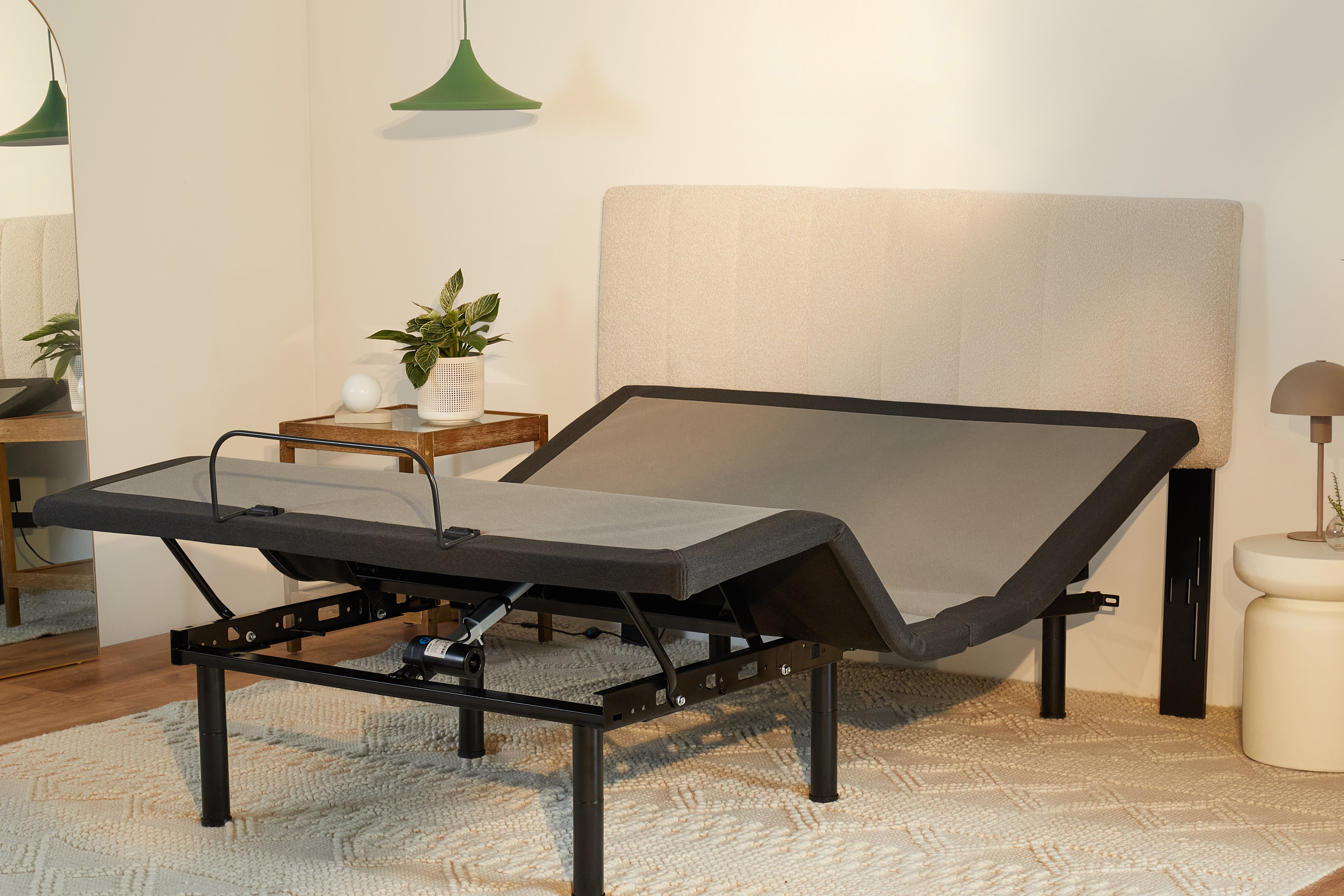 The Bliss Attachable Headboard, cream colored, attached to an adjustable bed frame