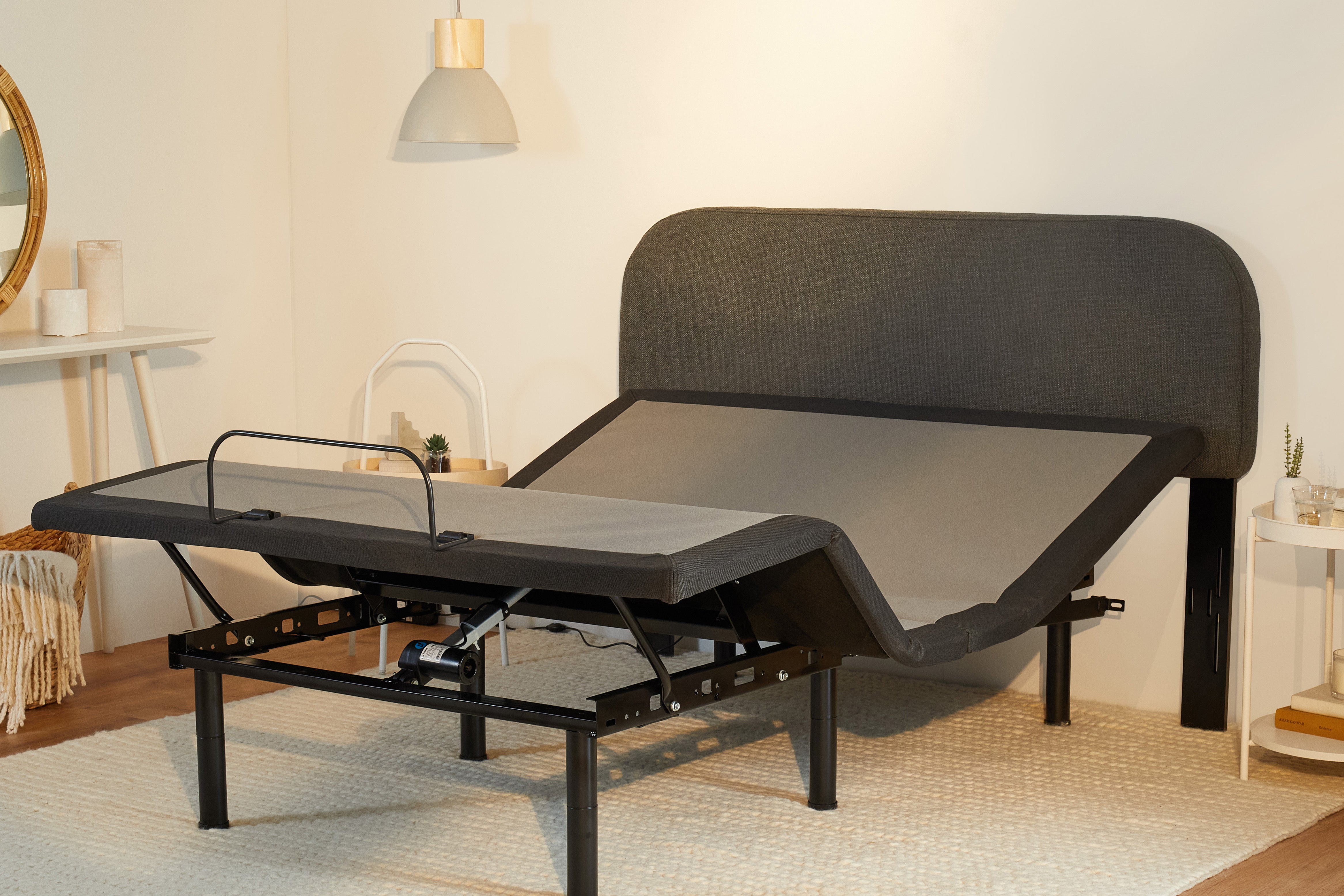 The Drift Attachable Headboard, slate colored, attached to an adjustable bed frame