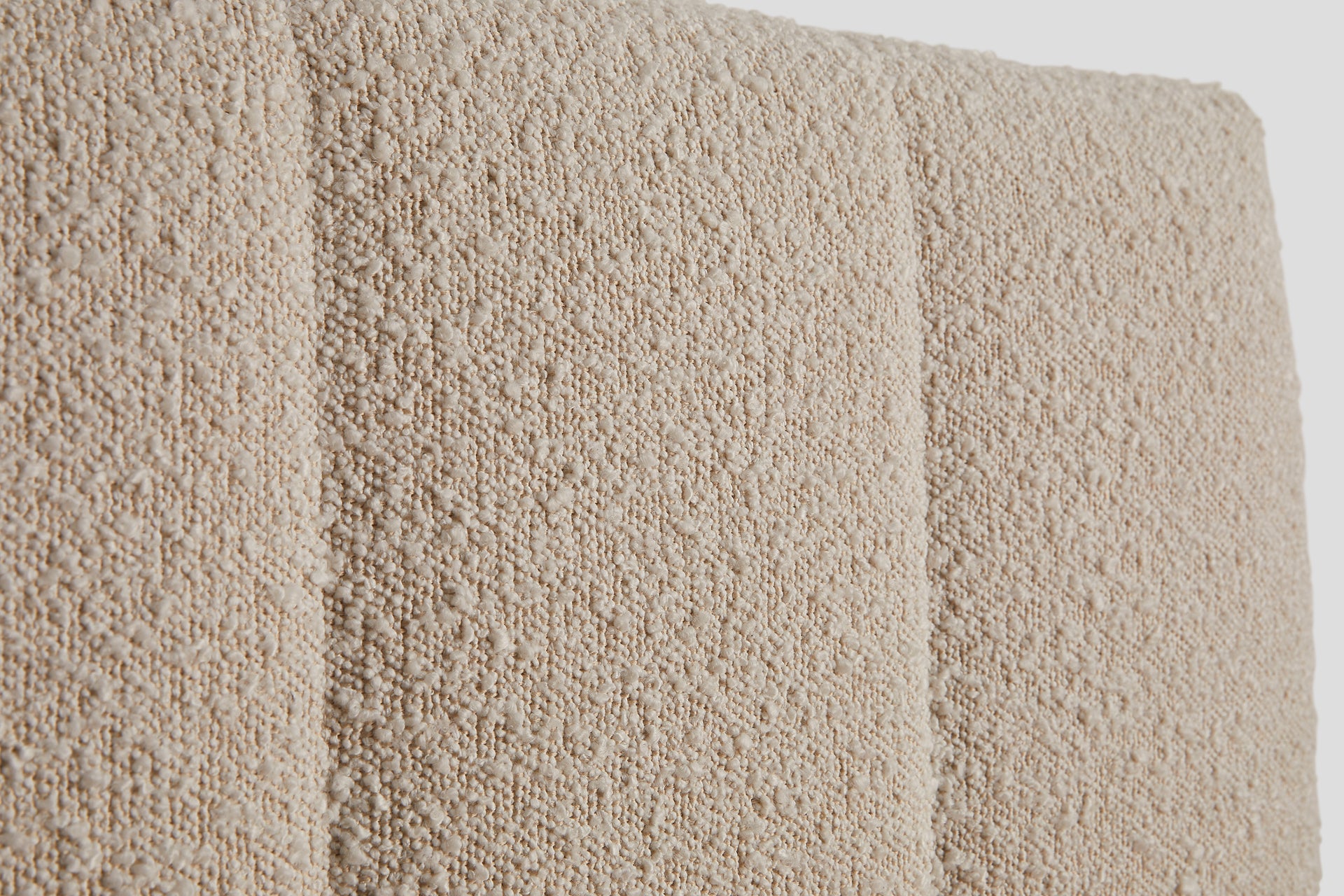 Close-up of fabric detail on Bliss Attachable Headboard, cream color.