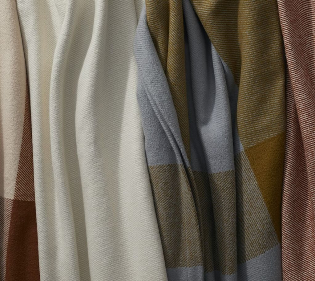 Close-up of various colored Cozy Woven Blankets