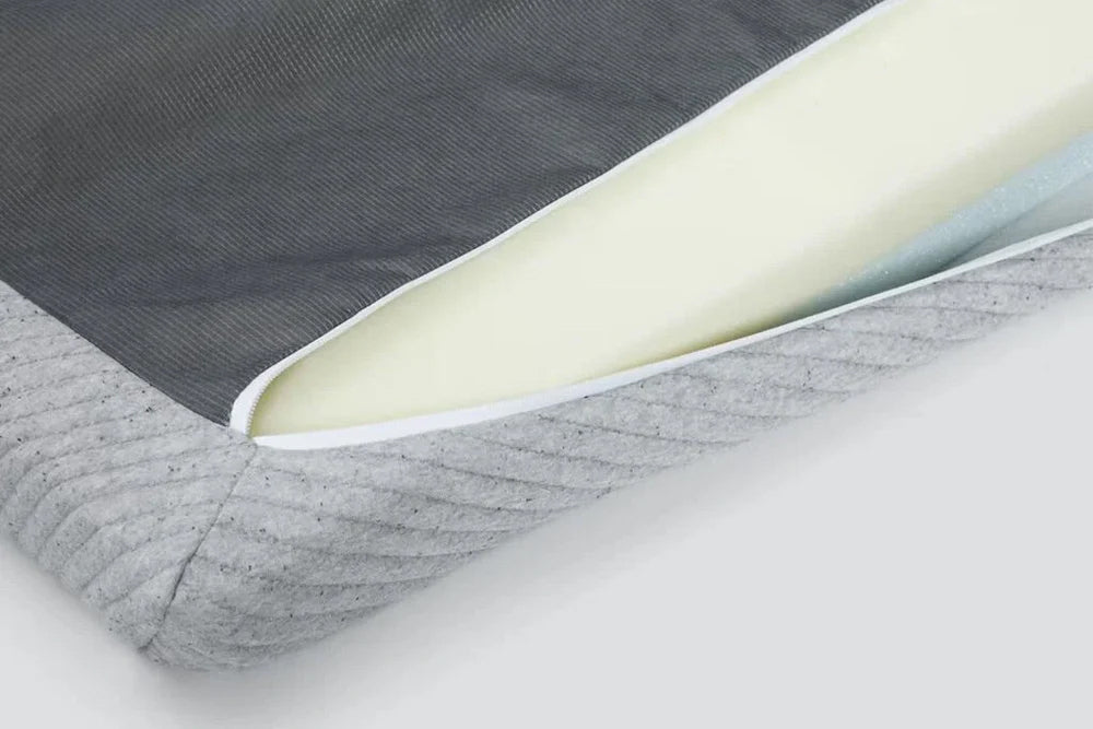 Close-up of a Comfy Mattress Topper, unzipped, to feature the inner foam