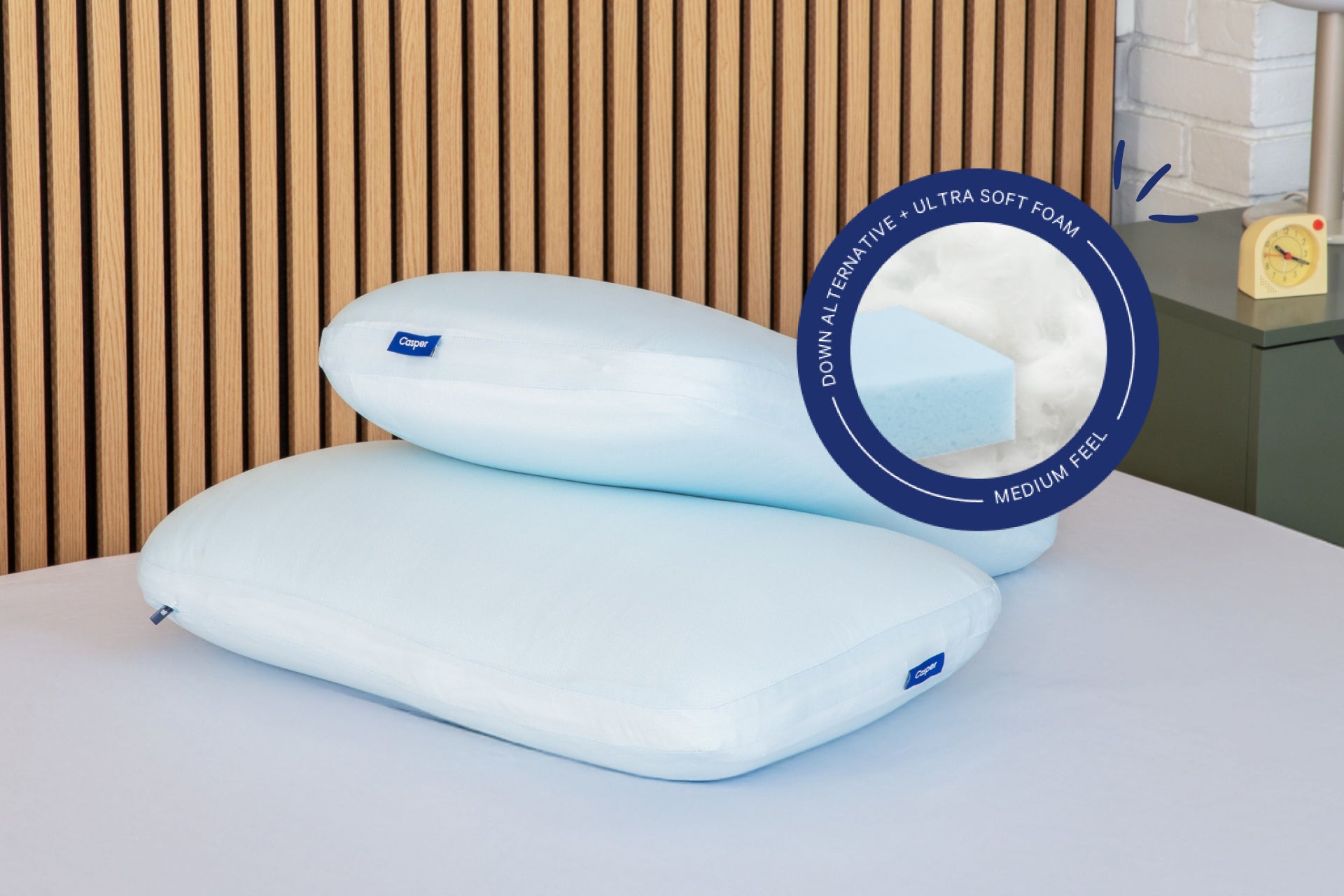 Two Hybrid Snow Pillows with a close-up of the inside material of the pillow. Text on the image reads "Down Alternative. Ultra soft foam. Medium feel."