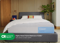Front view of Casper's Dream Max mattress on a bed frame with pillows and a folded blanket on top. At the bottom of the image appears text that reads "Consumer Reports. Highly rated hybrid mattress of 2026.* See below to learn more. *Consumer Reports does not endorse products or service."