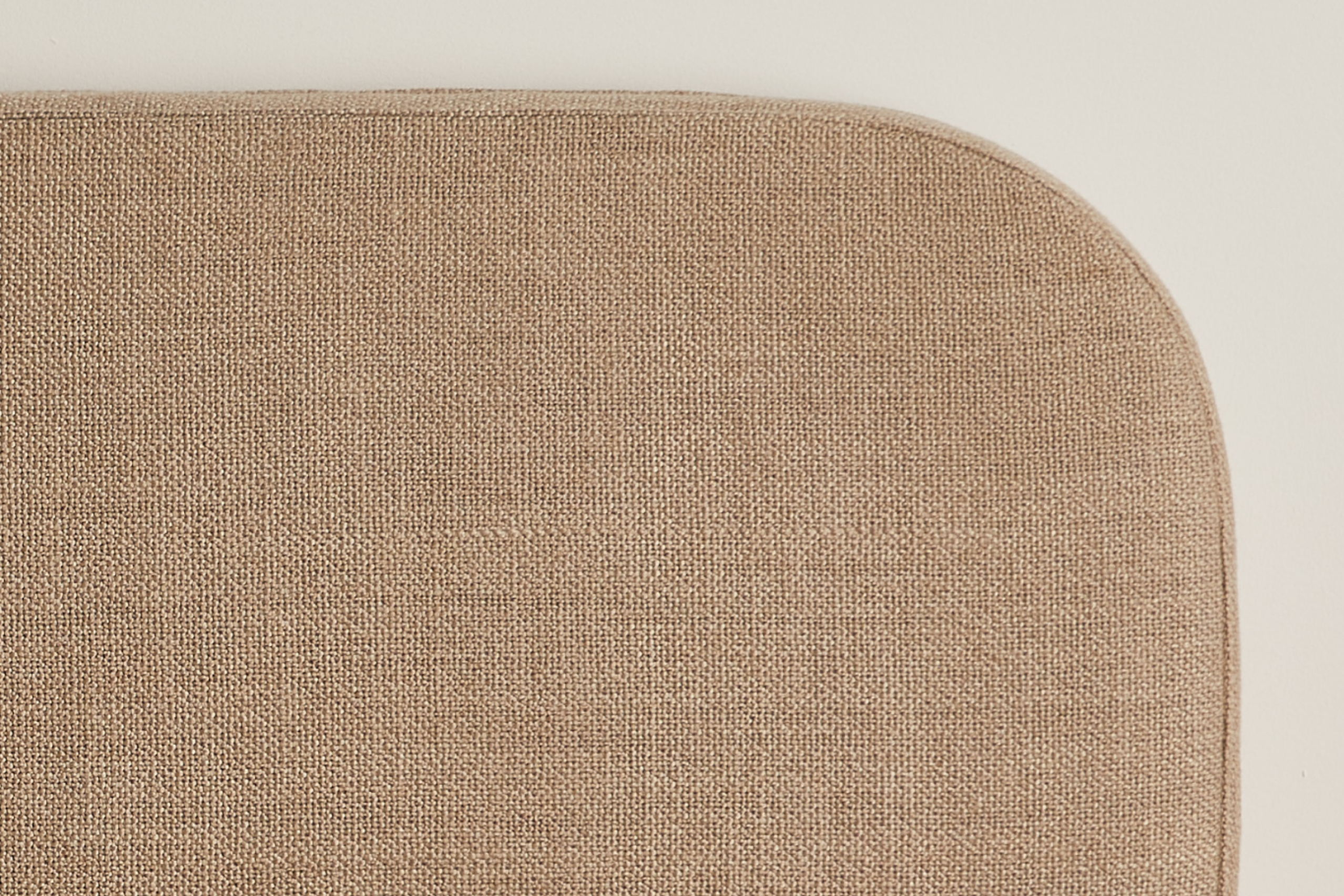 Close-up of the taupe colored fabric of the Drift Attachable Headboard