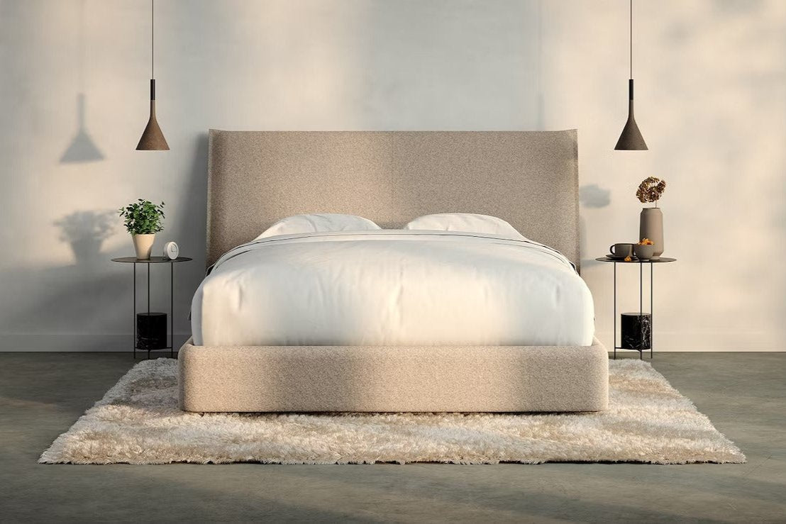 A fully made bed with a Haven Bed Frame and headboard. Front view.
