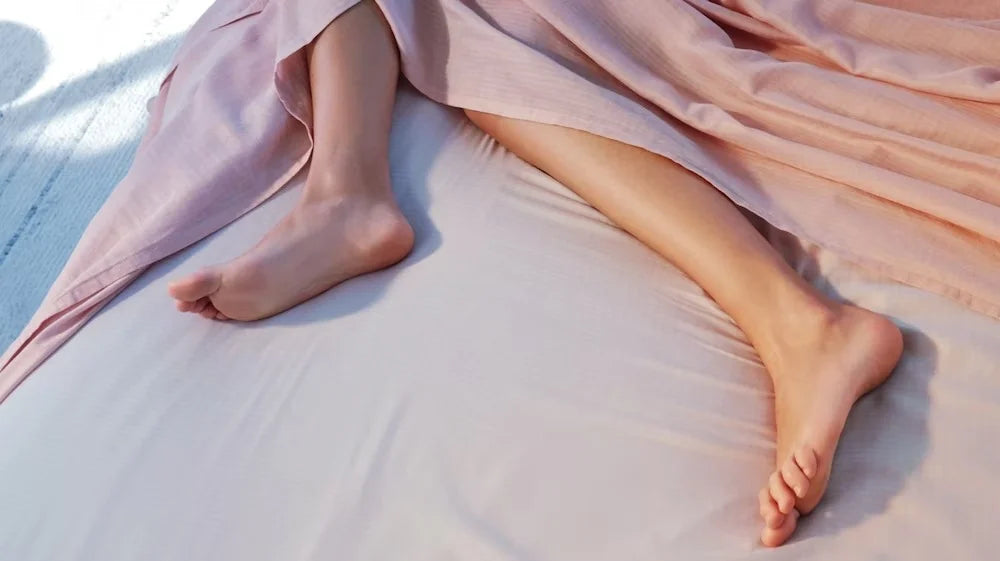 Someone's feet sticking out underneath their hyperlite cooling sheets
