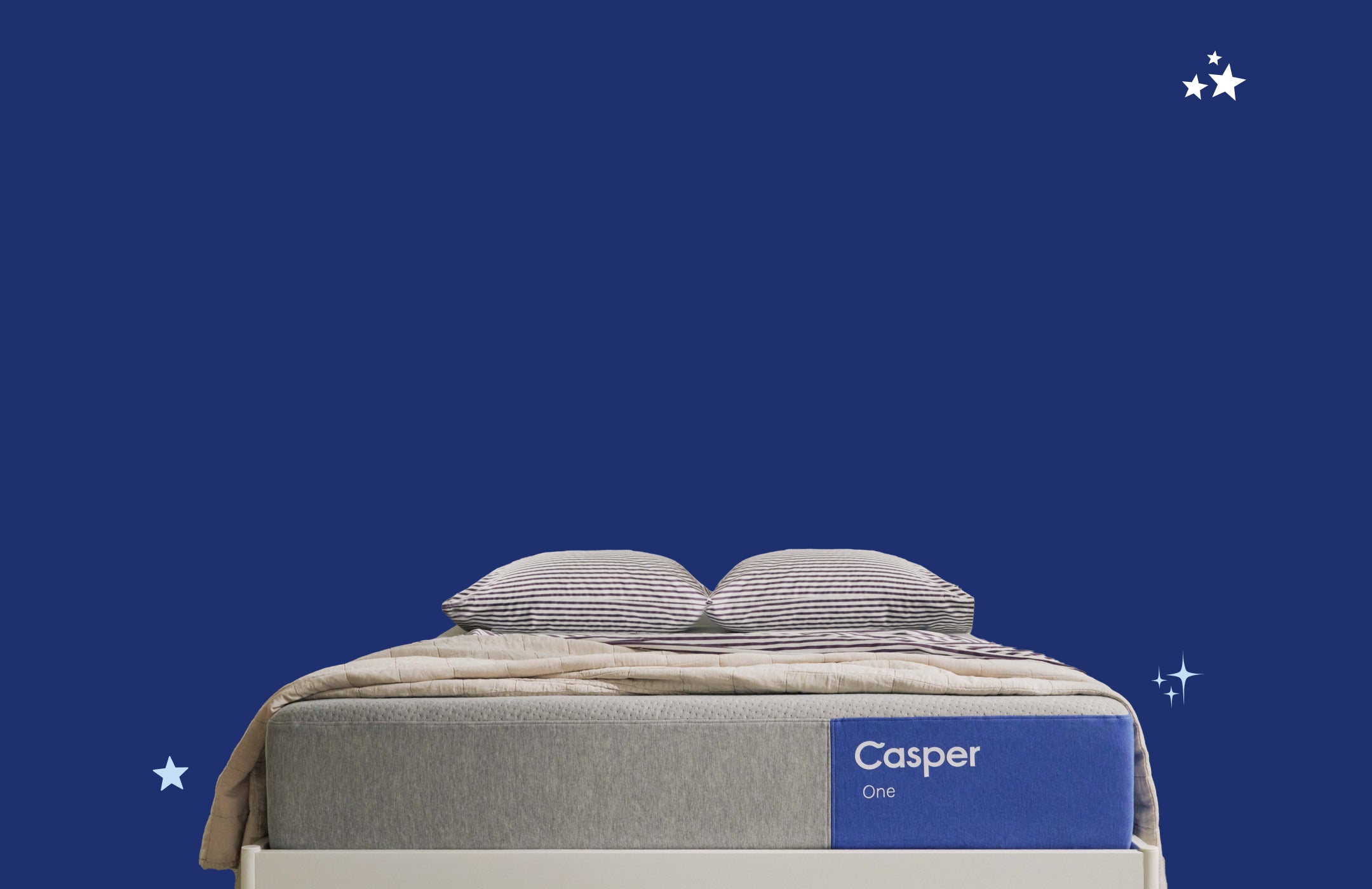 Casper One mattresses with two pillows and blanket on top