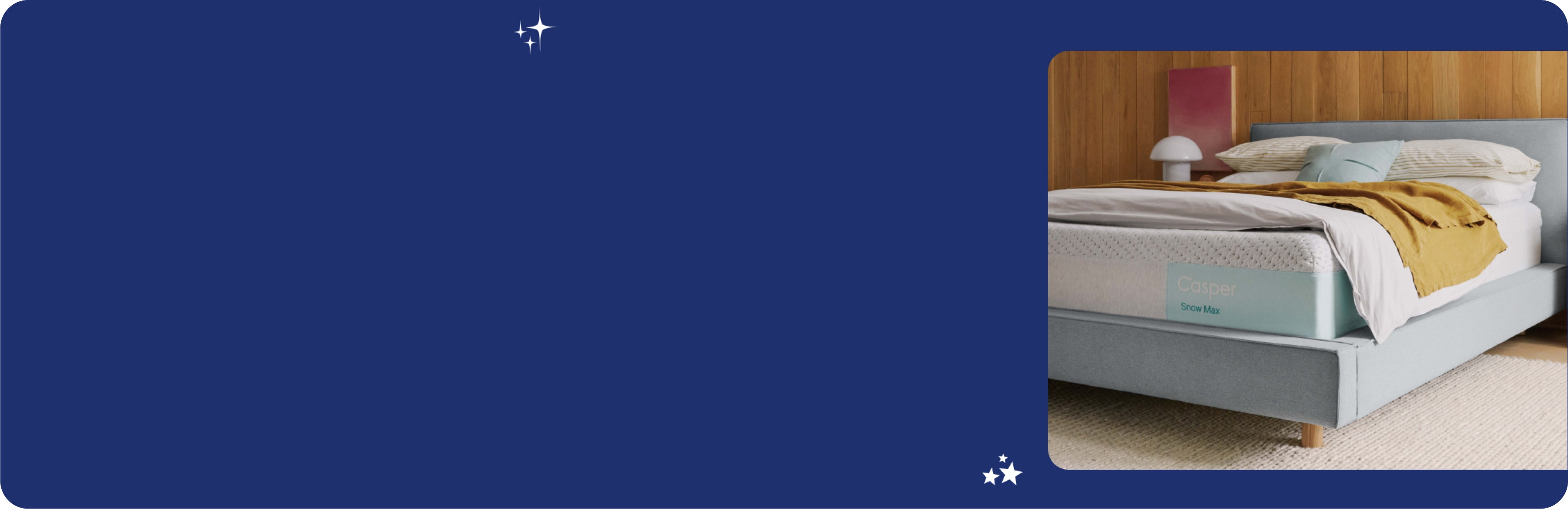 Casper Snow Max mattress on a bed with blankets and pillows on top