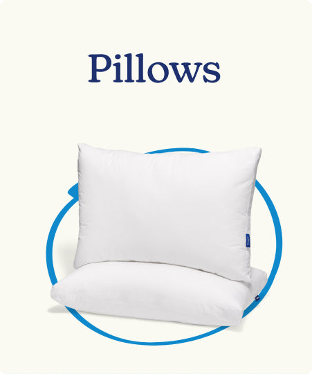 White pillows with a blue circle around them against a white background. The headline "Pillows" appears above the image.