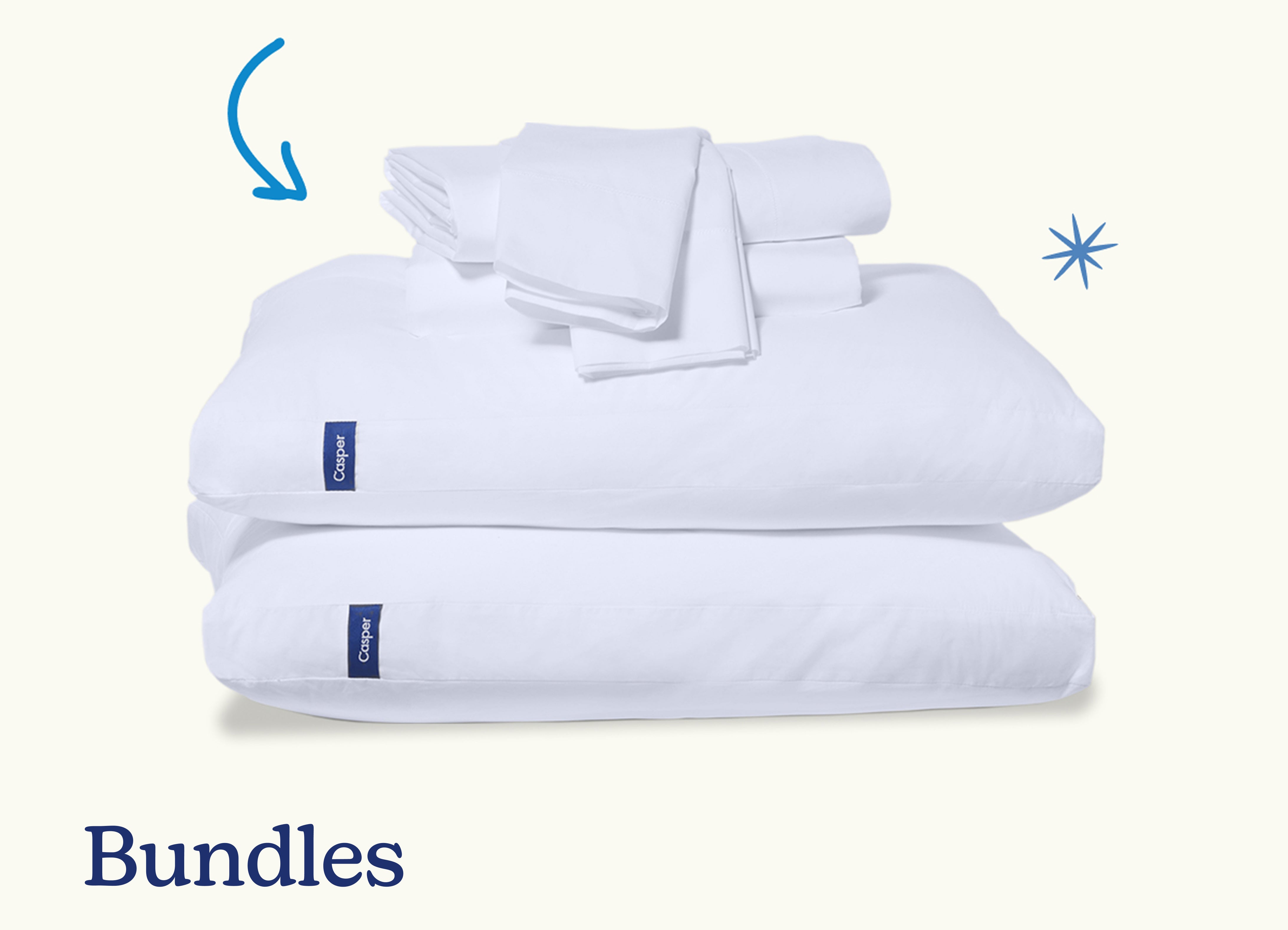 Bundles. A stack of two pillows with a folded sheet set on top