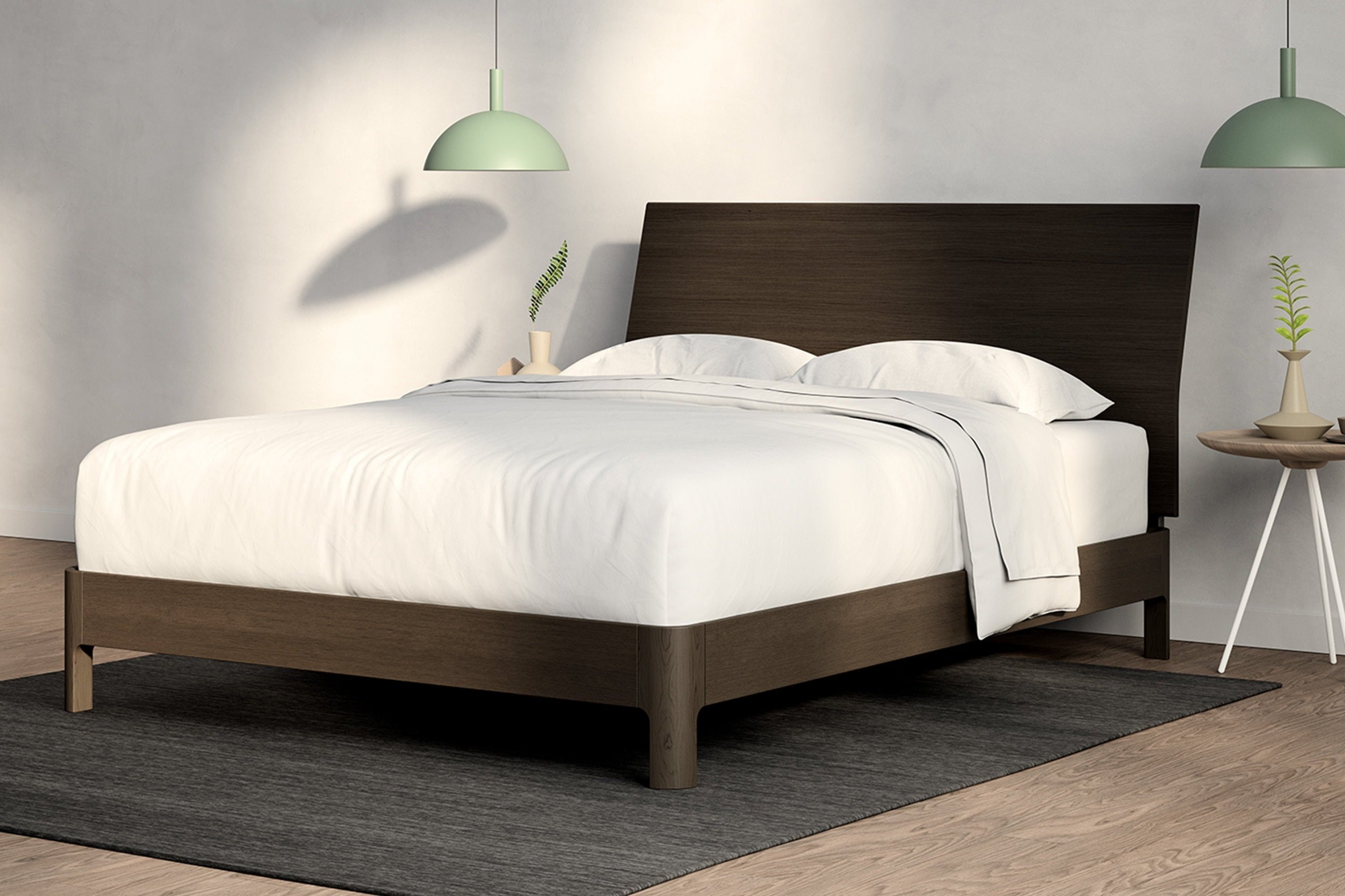 A fully made bed with a Repose Bed Frame and wooden headboard. Corner View.
