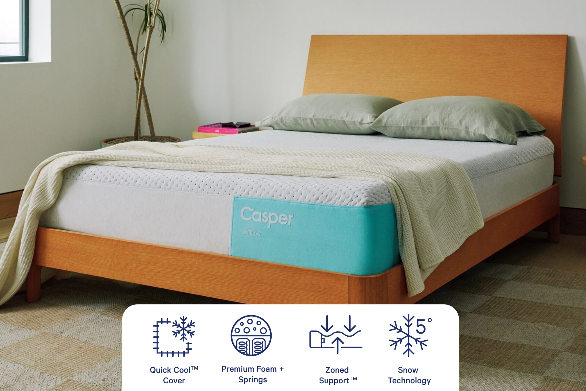 Corner view of Casper's Snow Mattress. Graphics at the bottom of the image indicate features including QuickCool™ Cover, Premium Foam and Springs, Zoned Support™, and Snow Technology.