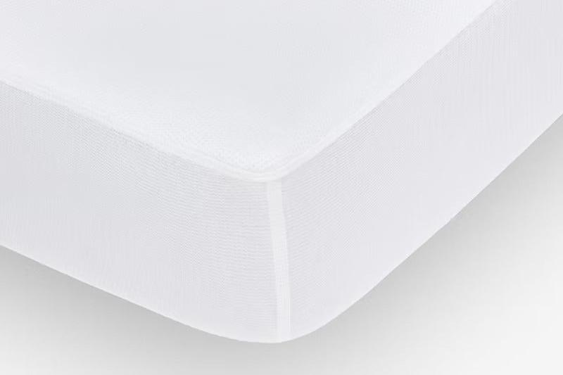 Close-up of the corner of a breathable mattress protector over a mattress