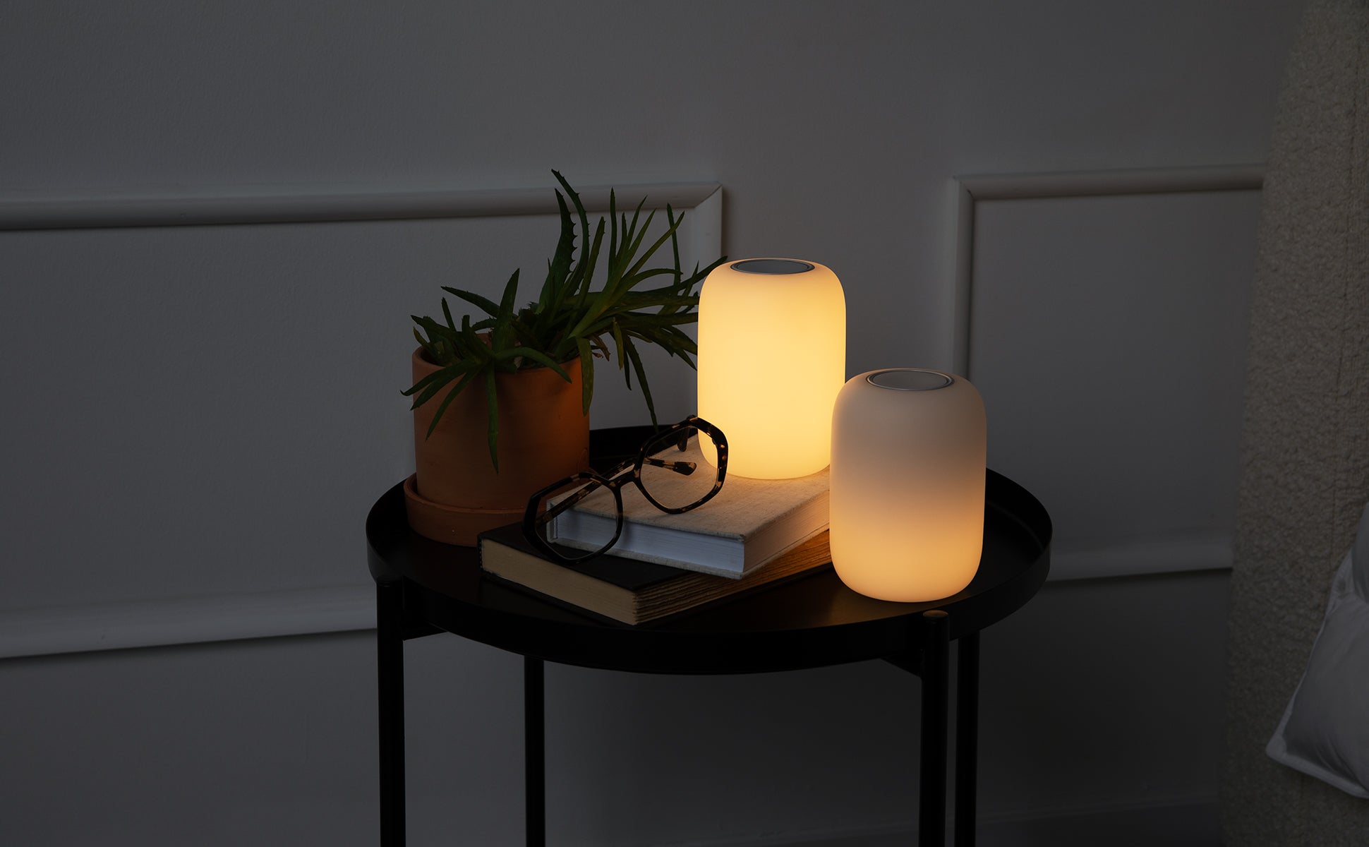 Two Glow Lights on a night table.