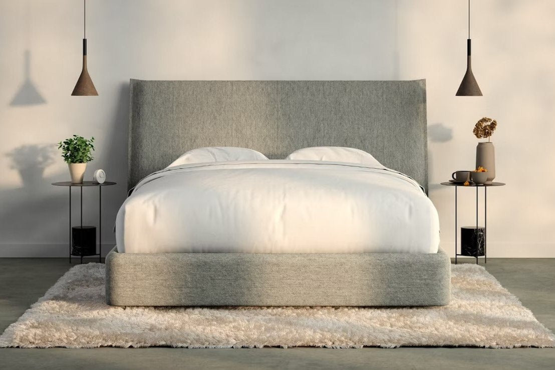A fully made bed with a Haven Bed Frame and headboard. Front view.