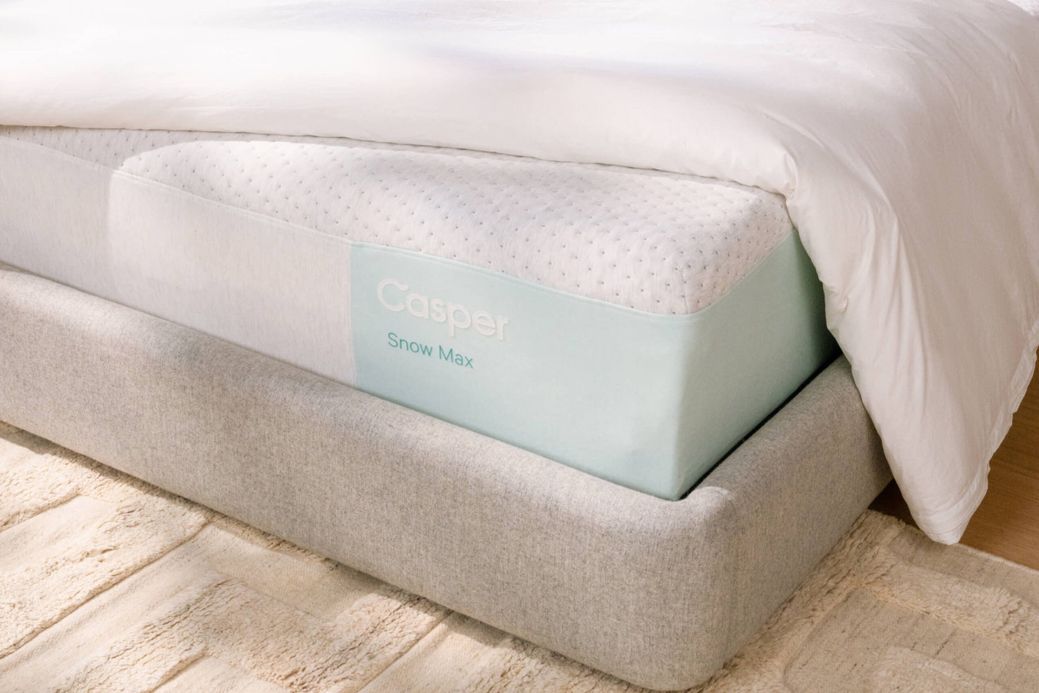 Snow Max mattress on Haven bedframe with duvet draped over
