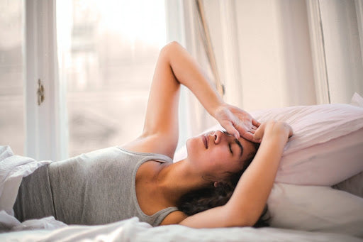 Woman in bed having troubles sleeping