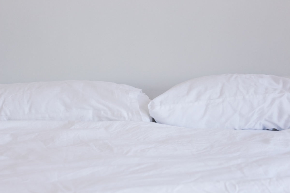 bed with white linen