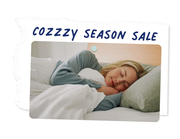 A woman sleeps peacefully on her side. The text "Cozzzy Season Sale" appears above the image