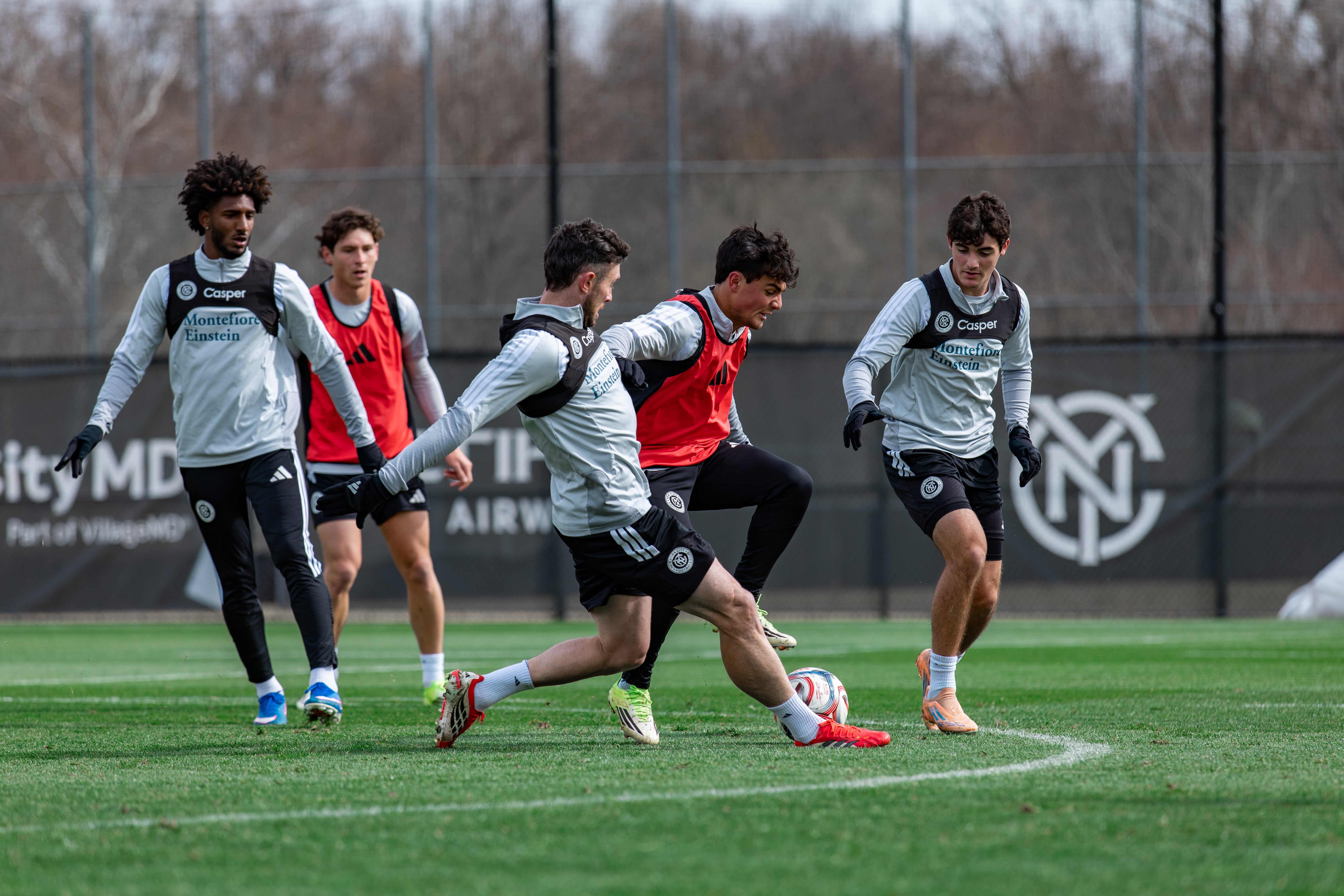 Group of soccer players practicing on a field