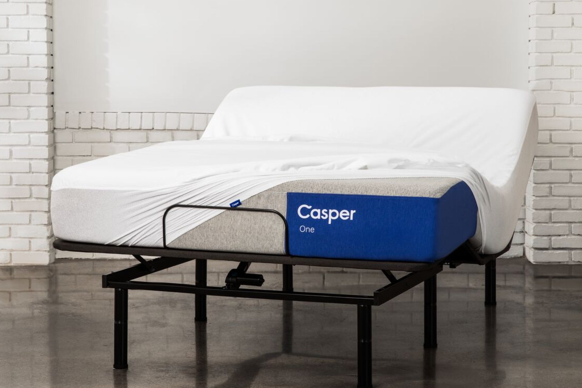 A waterproof mattress protector on Casper's The One mattress on an adjustable bed frame