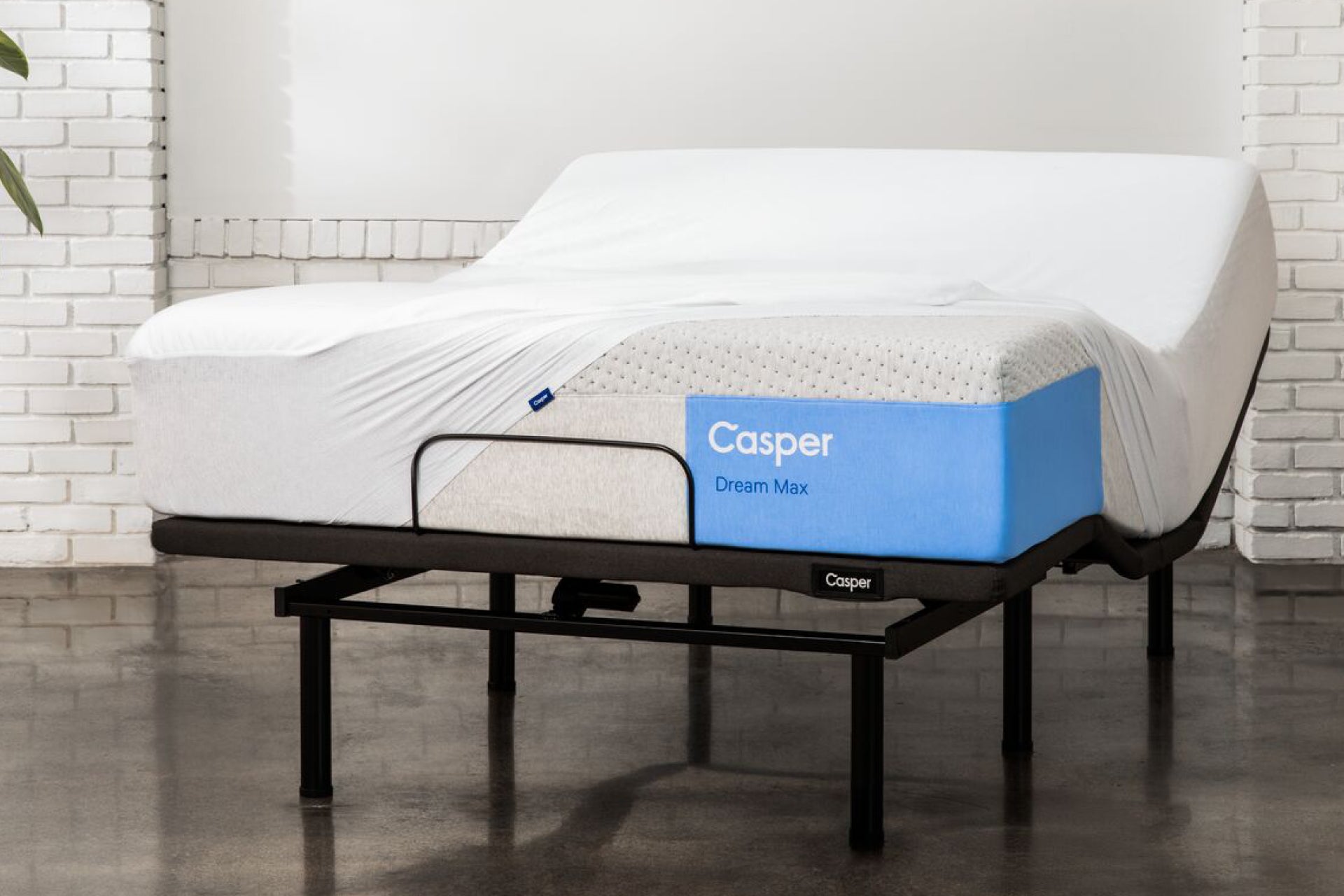Casper's Dream Max mattress on an Adjustable Base Max. A mattress protector is partially covering the mattress.