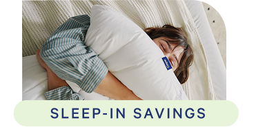 Person lying in bed, squeezing a pillow, with 'Sleep-in Savings' text overlay.