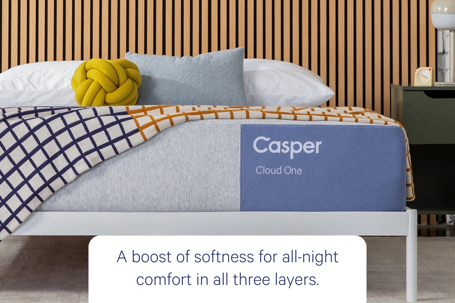 Front view of Casper's Cloud One mattress. Text at the bottom says "A boost of softness for all-night comfort in all three layers.