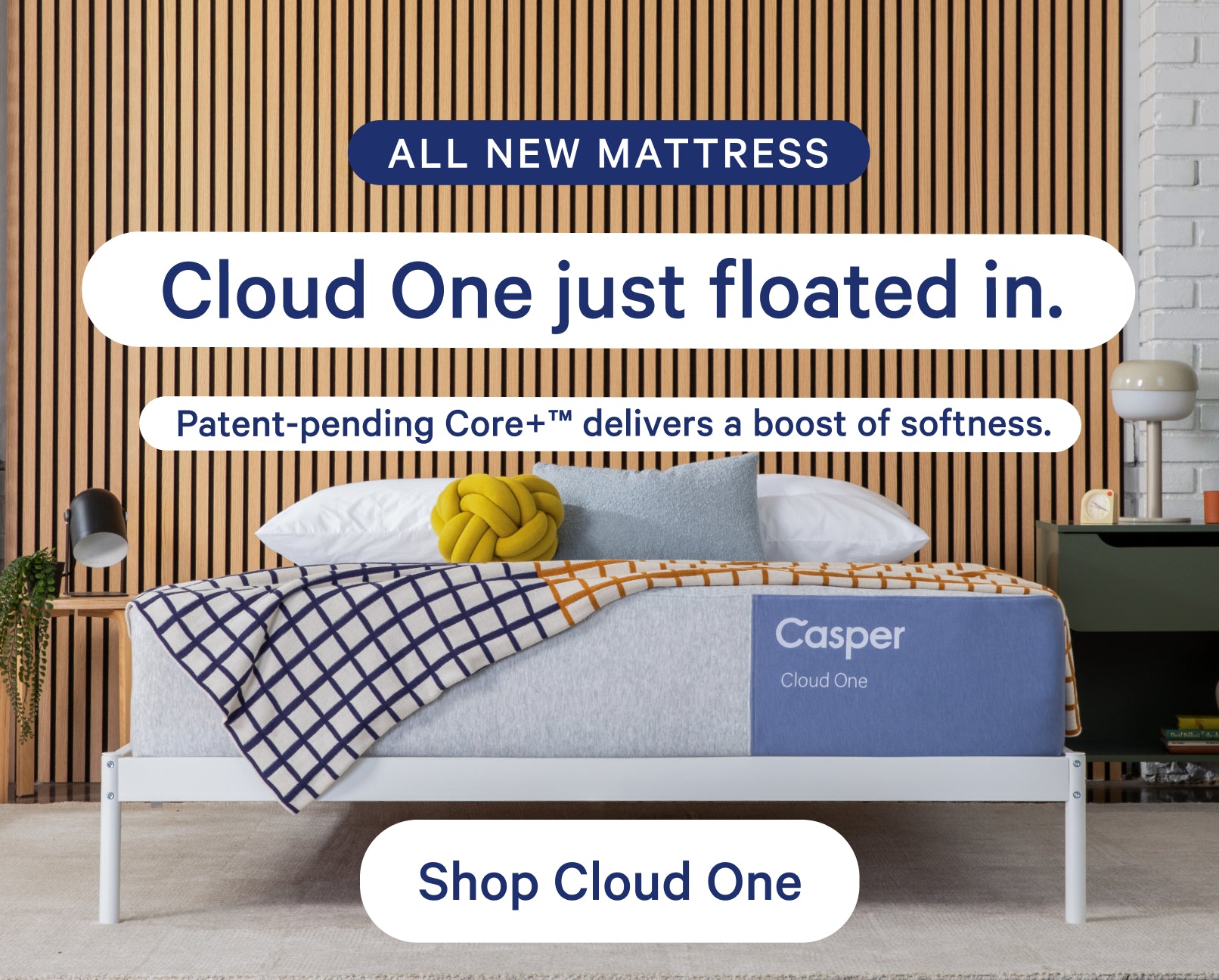 Casper Cloud One mattress with a cozy setup in a room setting, featuring text about its softness.