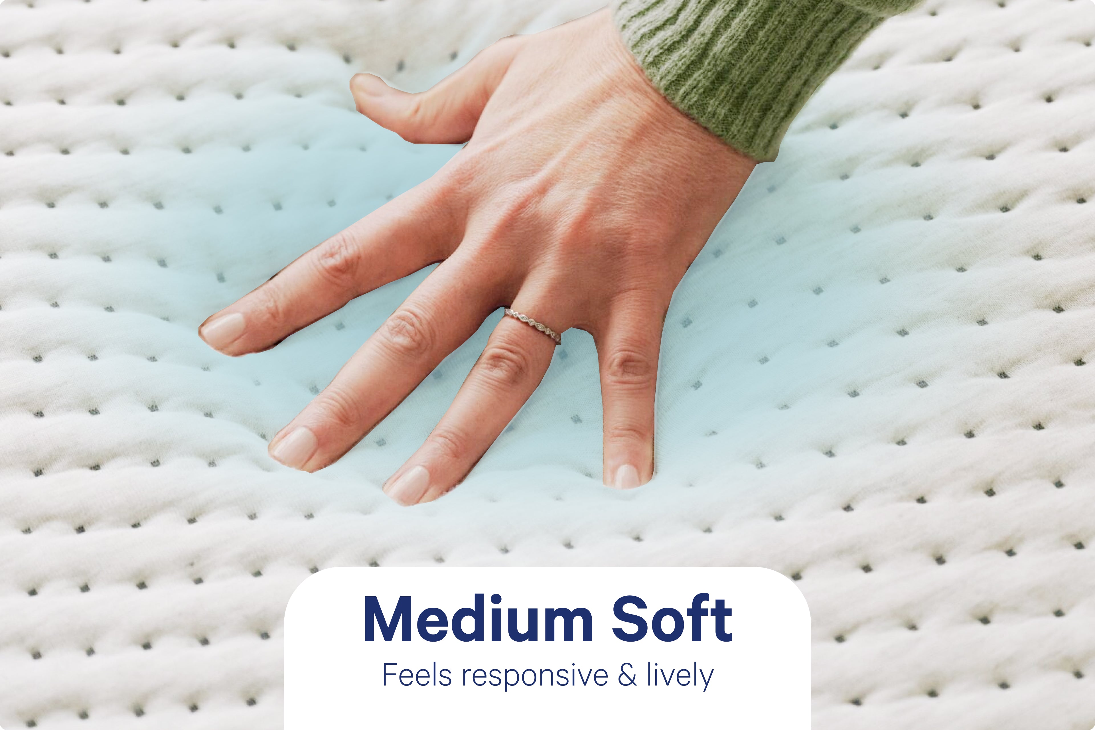 A person's hand pressing down to feel the Dream Max Mattress with QuickCool™ Cover. Text on the image indicates that its firmness level is Medium Soft and feels responsive & lively. A very light shade of cool blue underneath the hand indicates the cool touch of the QuickCool™ Cover.