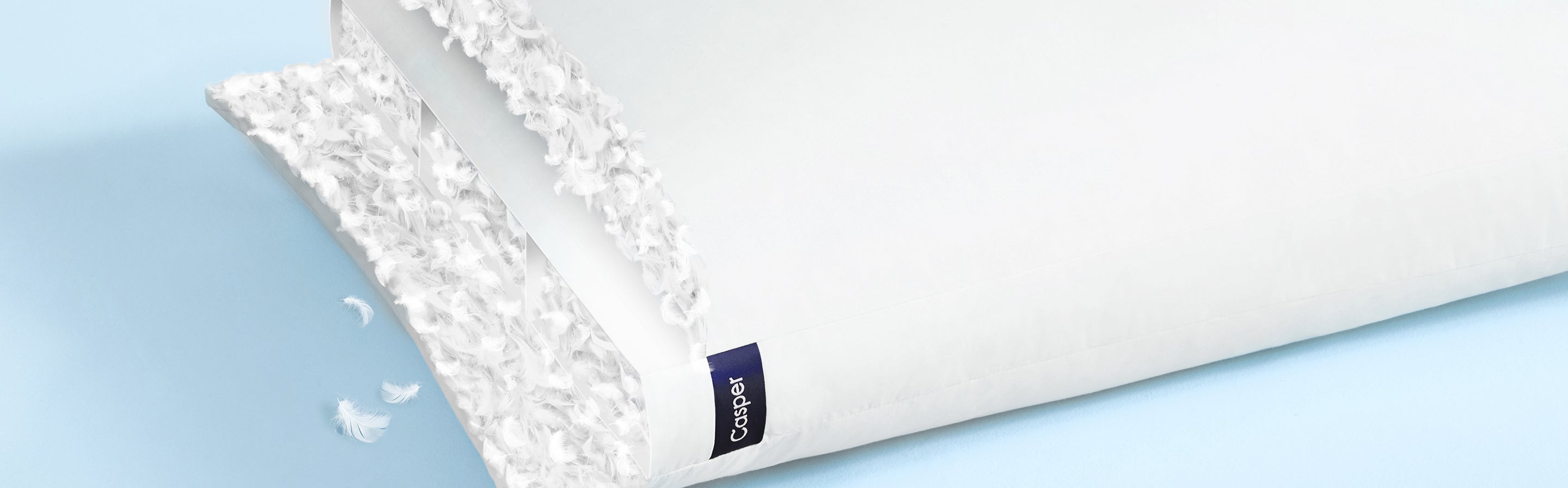 A computer image of a cross section of Casper's Down Pillow, revealing the down inside the pillow.