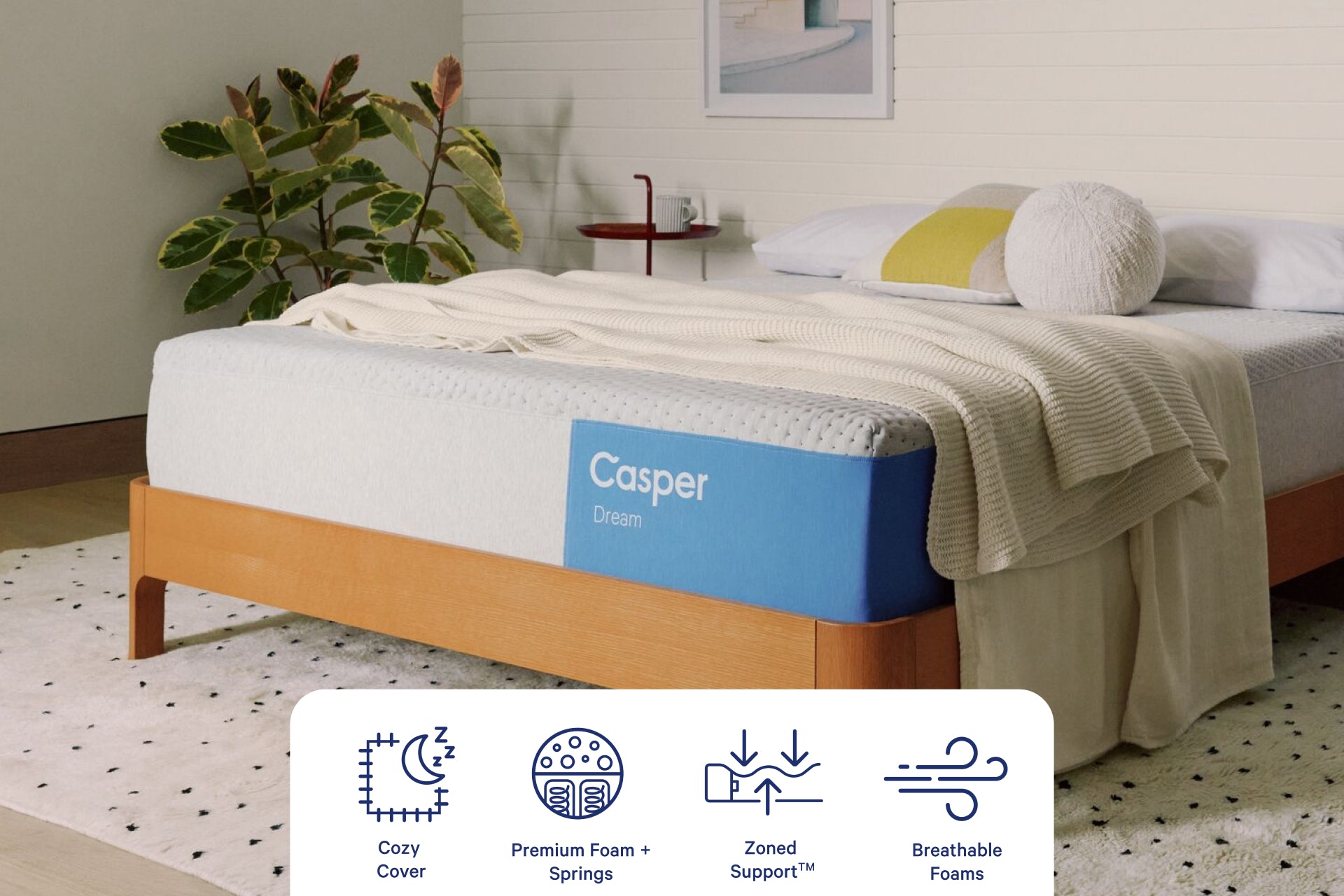 Corner view of Casper's Dream Mattress. Graphics at the bottom of the image indicate features including Cozy Cover, Premium Foam and Springs, Zoned Support™, and Breathable Foams.