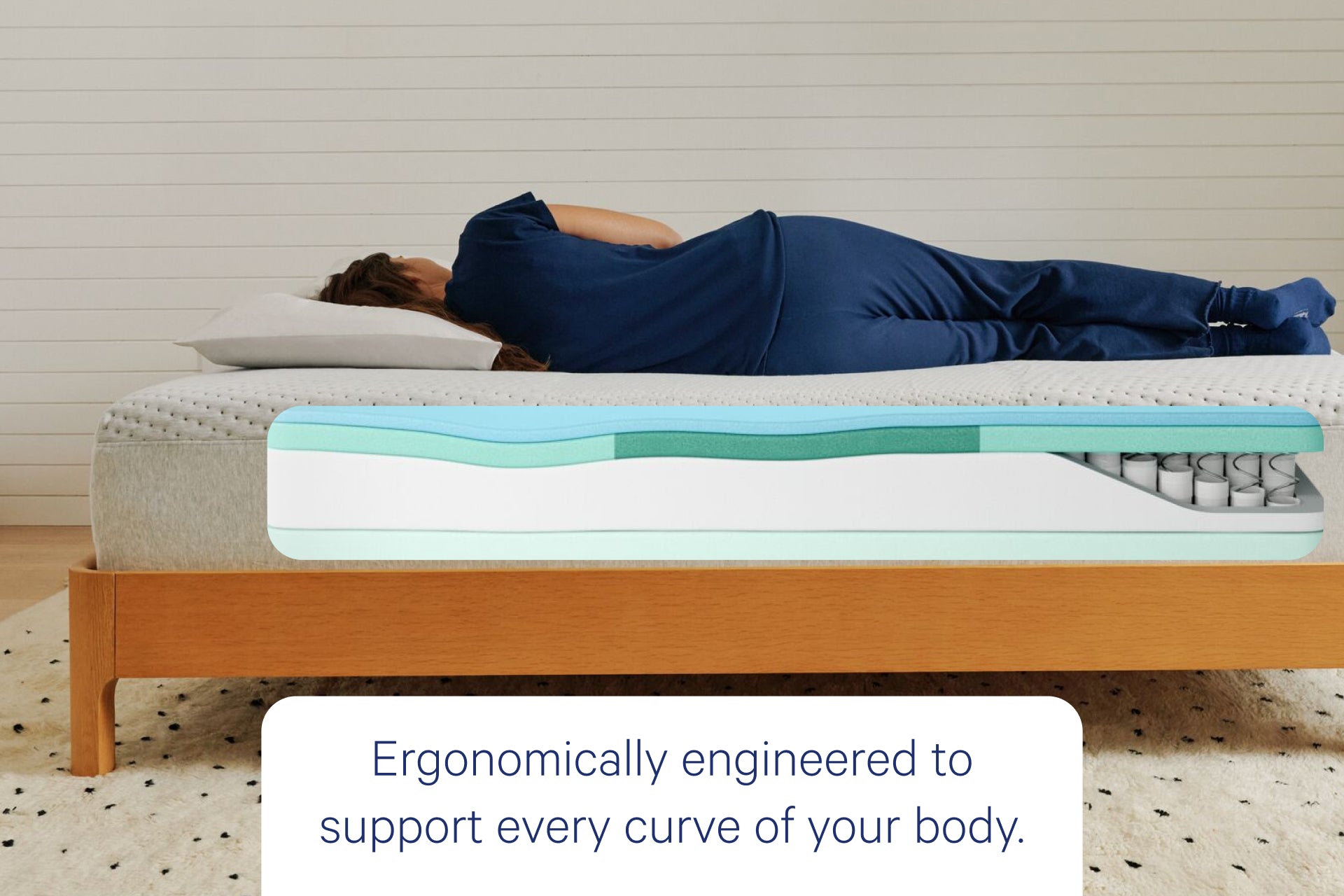 Person lying on Casper's Dream mattress with a graphic showing the inner layers of the mattress. Text on the image says "ergonomically engineered to support every curve of your body."