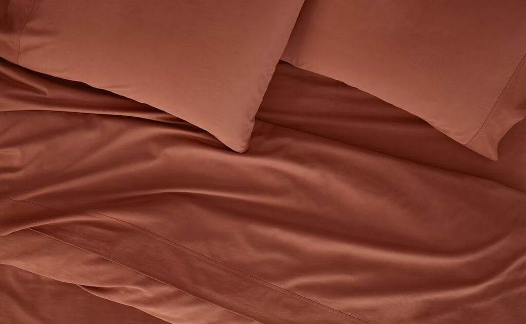 Close-up of Spice Flannel products on a bed