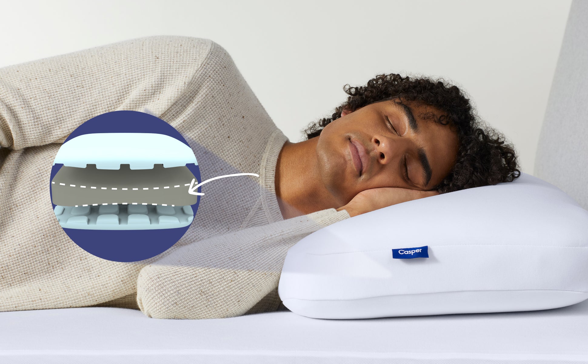 Close-up of a perosn lying on their side on the Foam Pillow. A computer-generated illustration of the inside of the pillow indicates how the middle layer's contour helps to support proper alignment while sleeping.