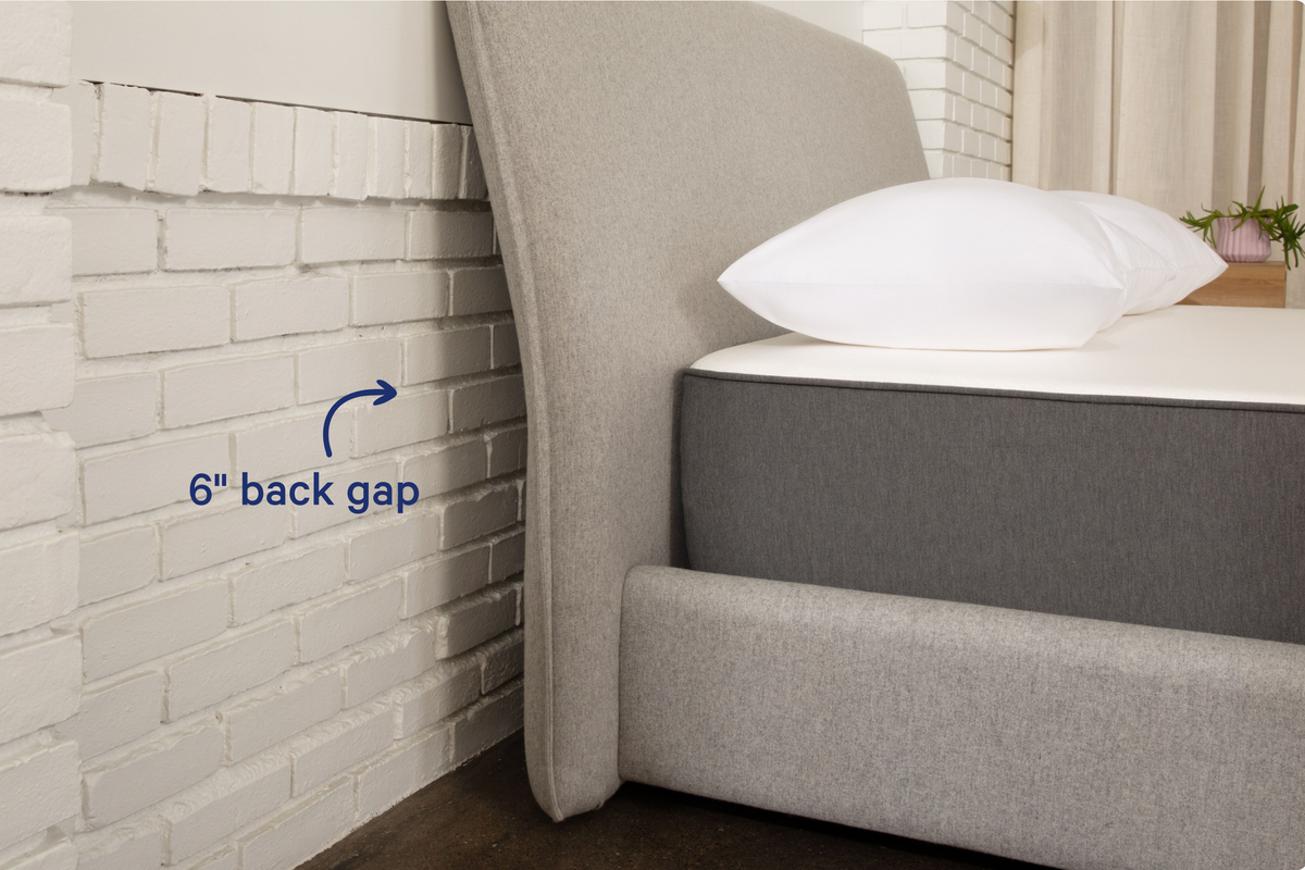 Haven Bed Frame, gray, side view of the headboard. 6-inch back gap between the headboard and the wall behind it.
