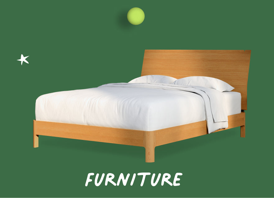 Wooden bed with white bedding on a green holiday background, labeled 'Furniture'.