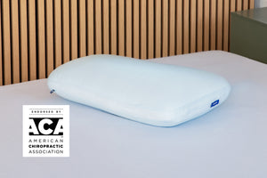 Casper's Hybrid Snow Pillow on a mattress. A badge on the image says "Endorsed by the ACA - American Chiropractic Association."