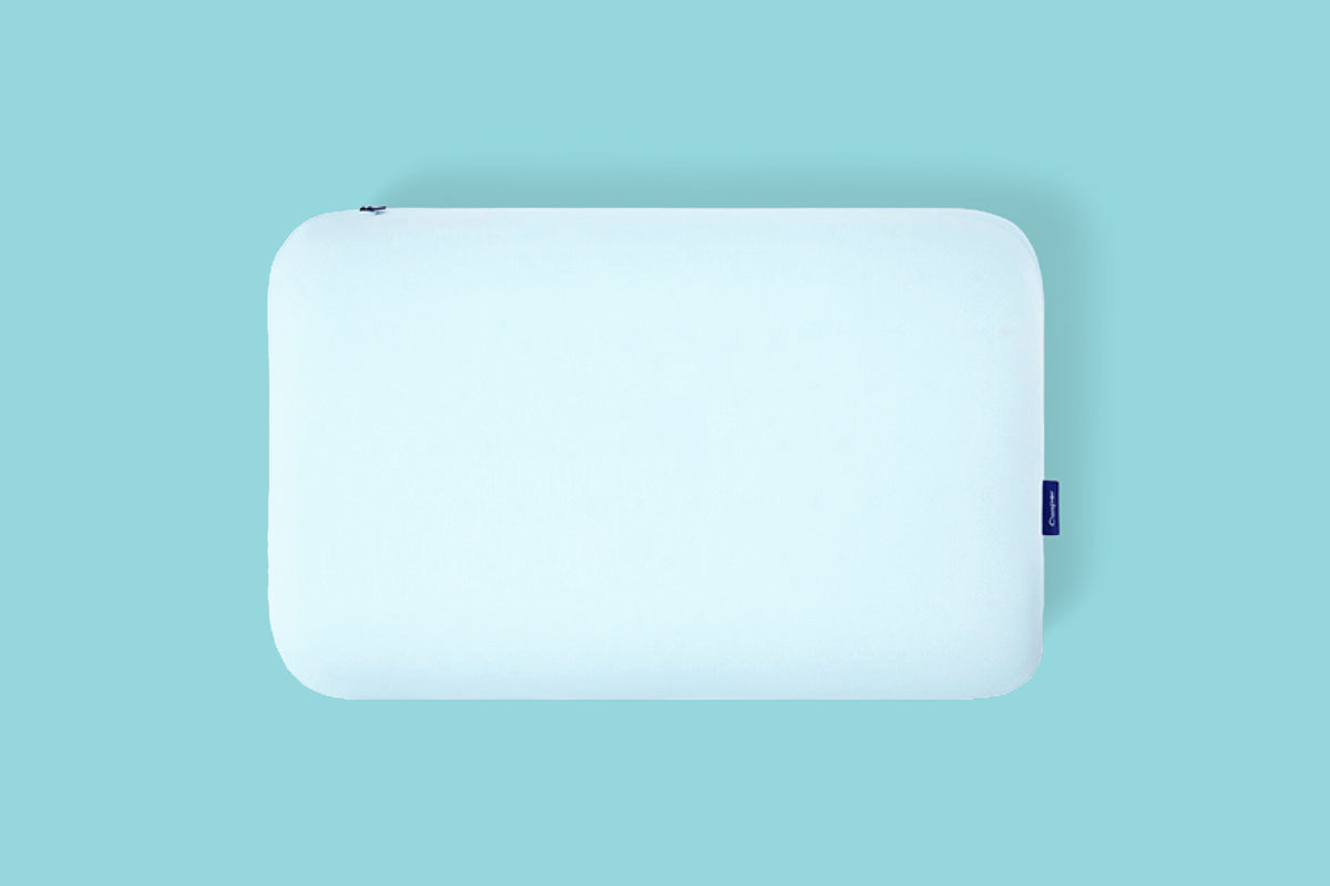 Casper's Hybrid Snow Pillow against a light turquoise background.
