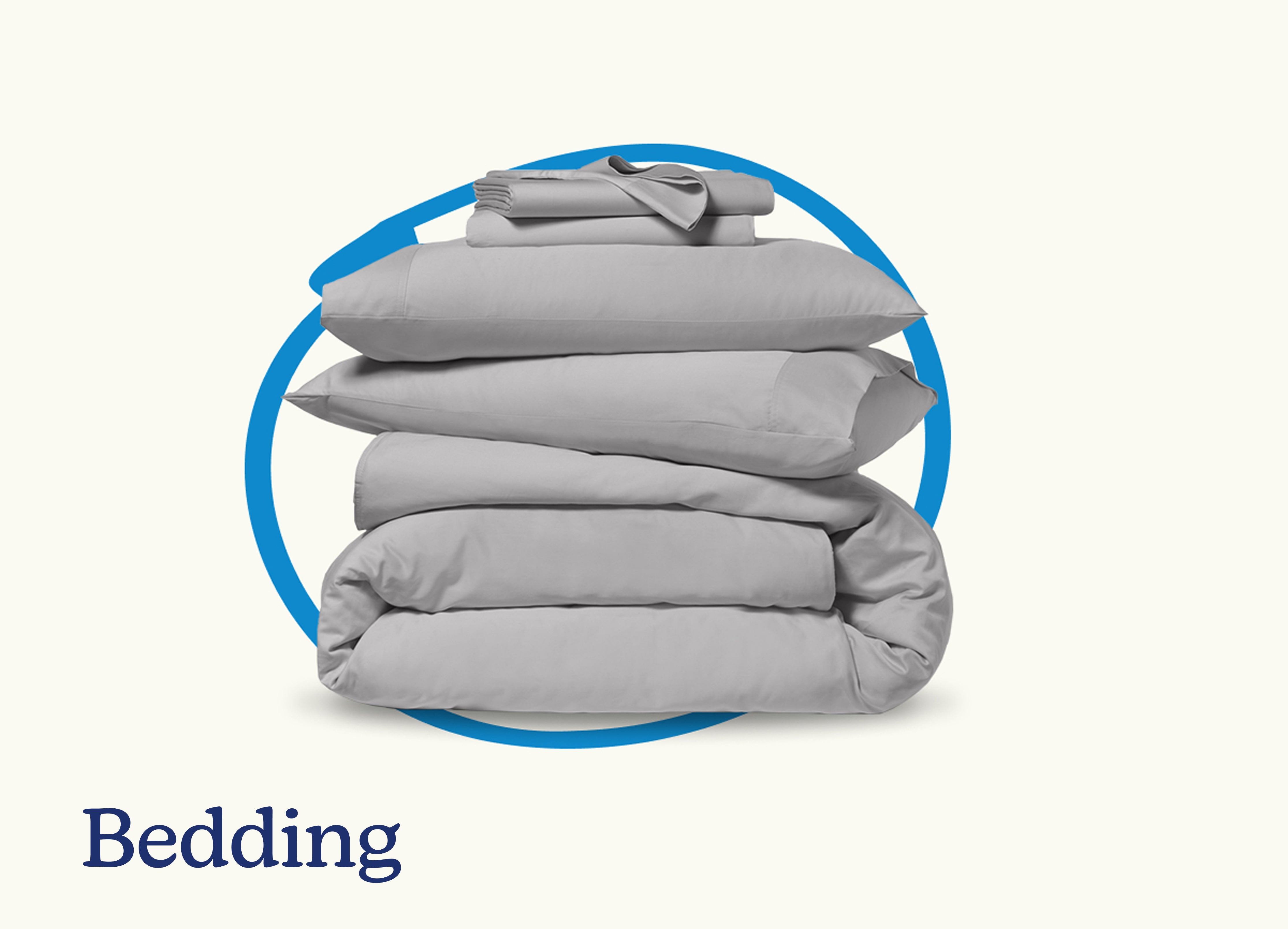 Bedding. A stack of a folded duvet, pillows, and a sheet set with a blue circle around them