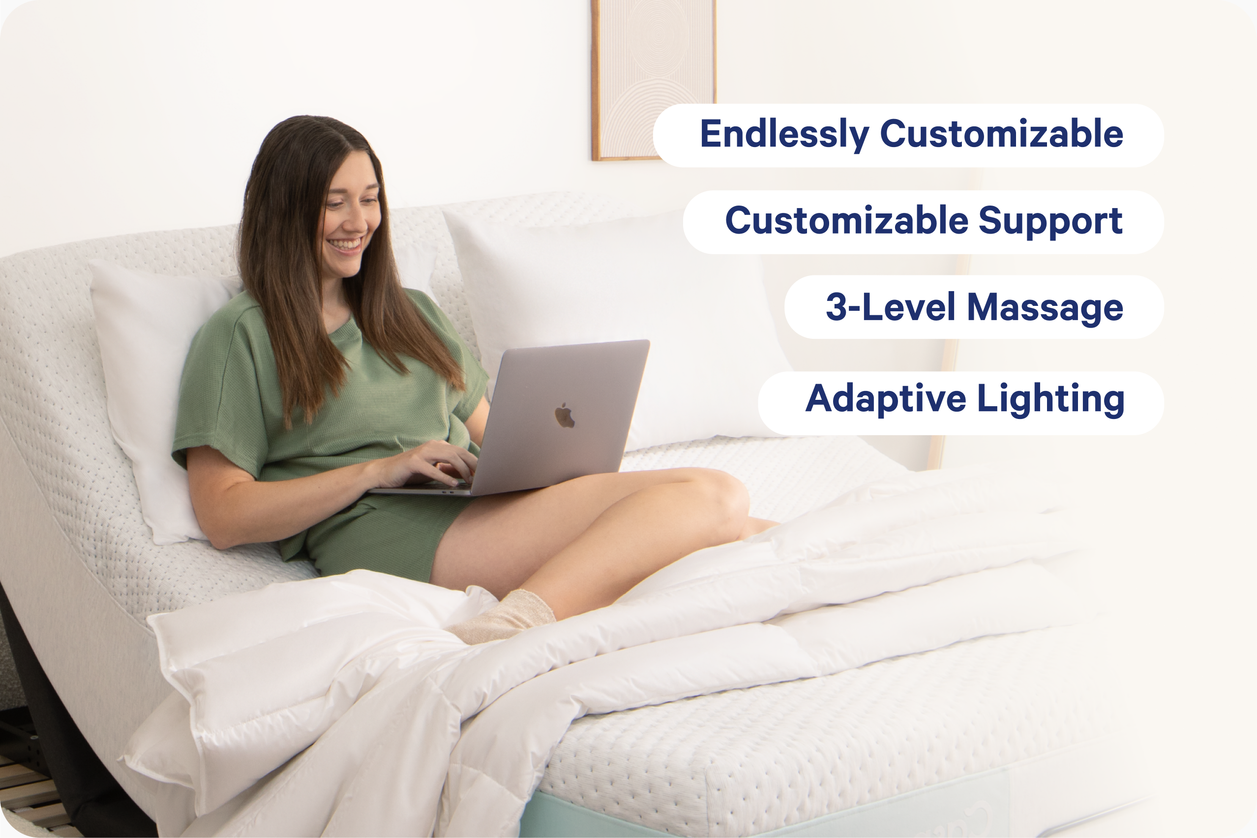 A woman in a green outfit sits in bed with a laptop, with white bedding and pillows around her. Four text callouts on the right read "Endlessly Customizable," "Adjust Remotely," "3-Level Massage," and "Adaptive Lighting," referring to the adjustable bed frame.