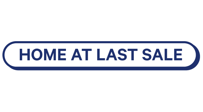 Blue oval sign with 'HOME AT LAST SALE' text