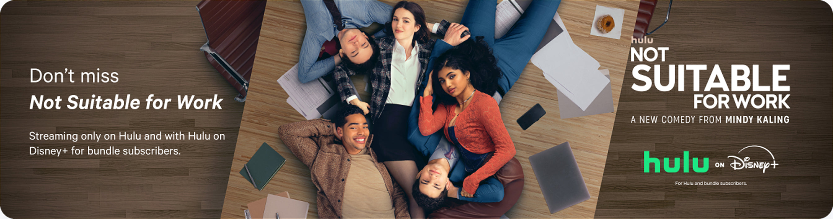 Promotional poster for a Hulu comedy, Not Suitable for Work, with people sitting in a circle on a wooden floor.