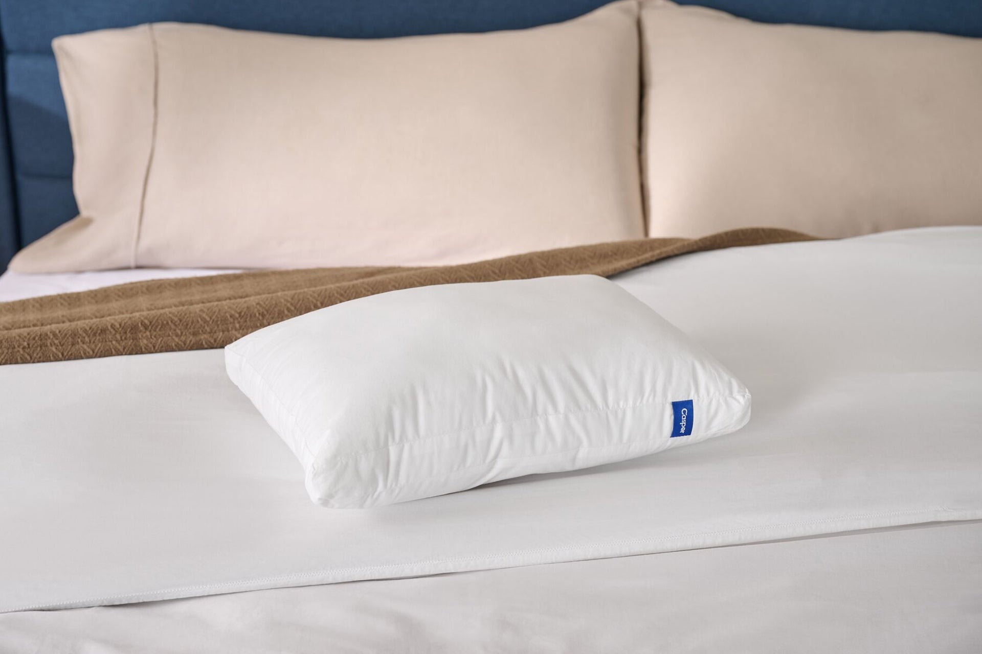 Casper's mini Nap Pillow on a bed