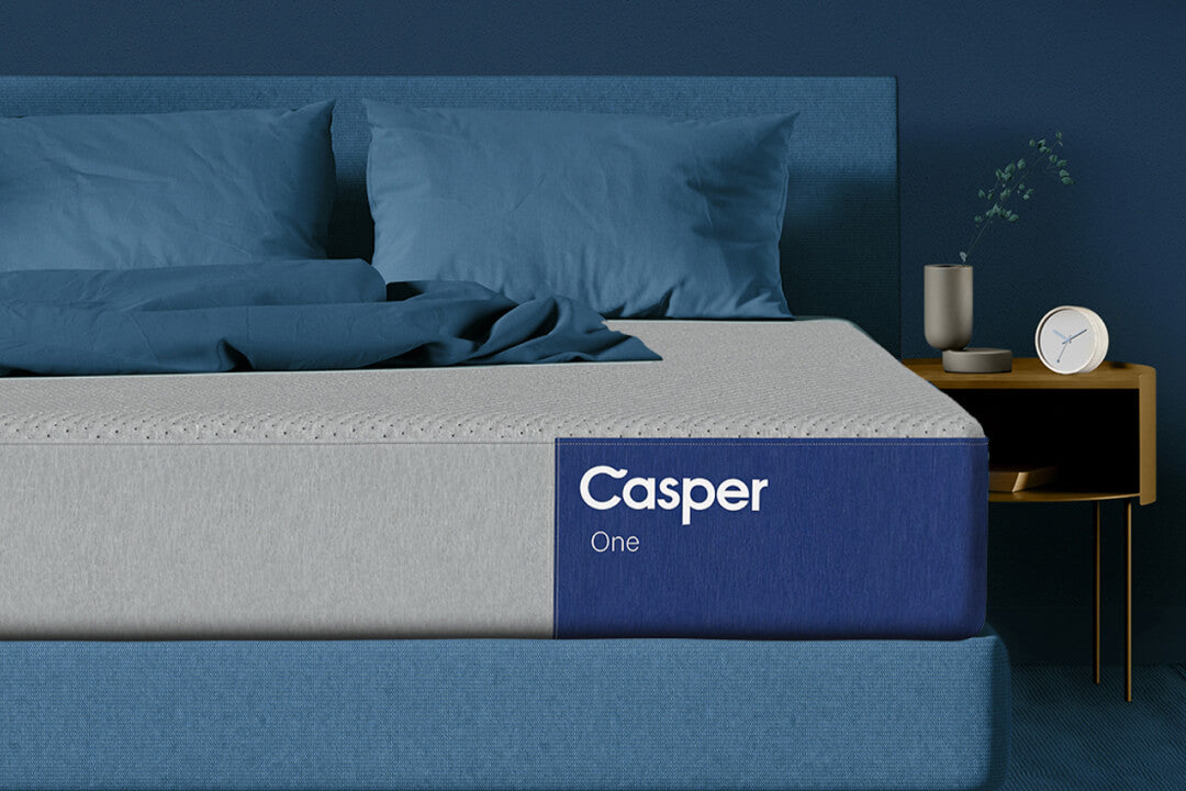 photo of a bed taken in front of the bed, focusing on the front-right corner