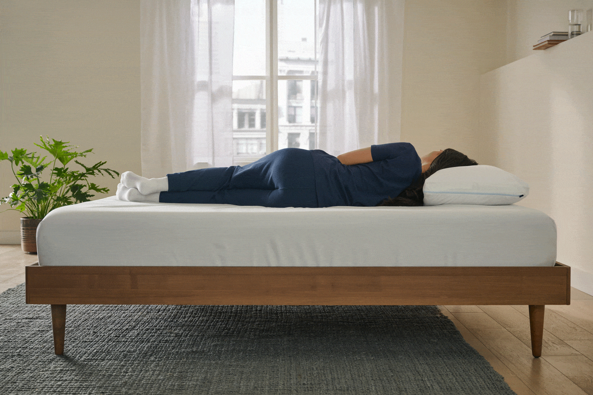 Motion image of a woman sleeping on a bed in different positions
