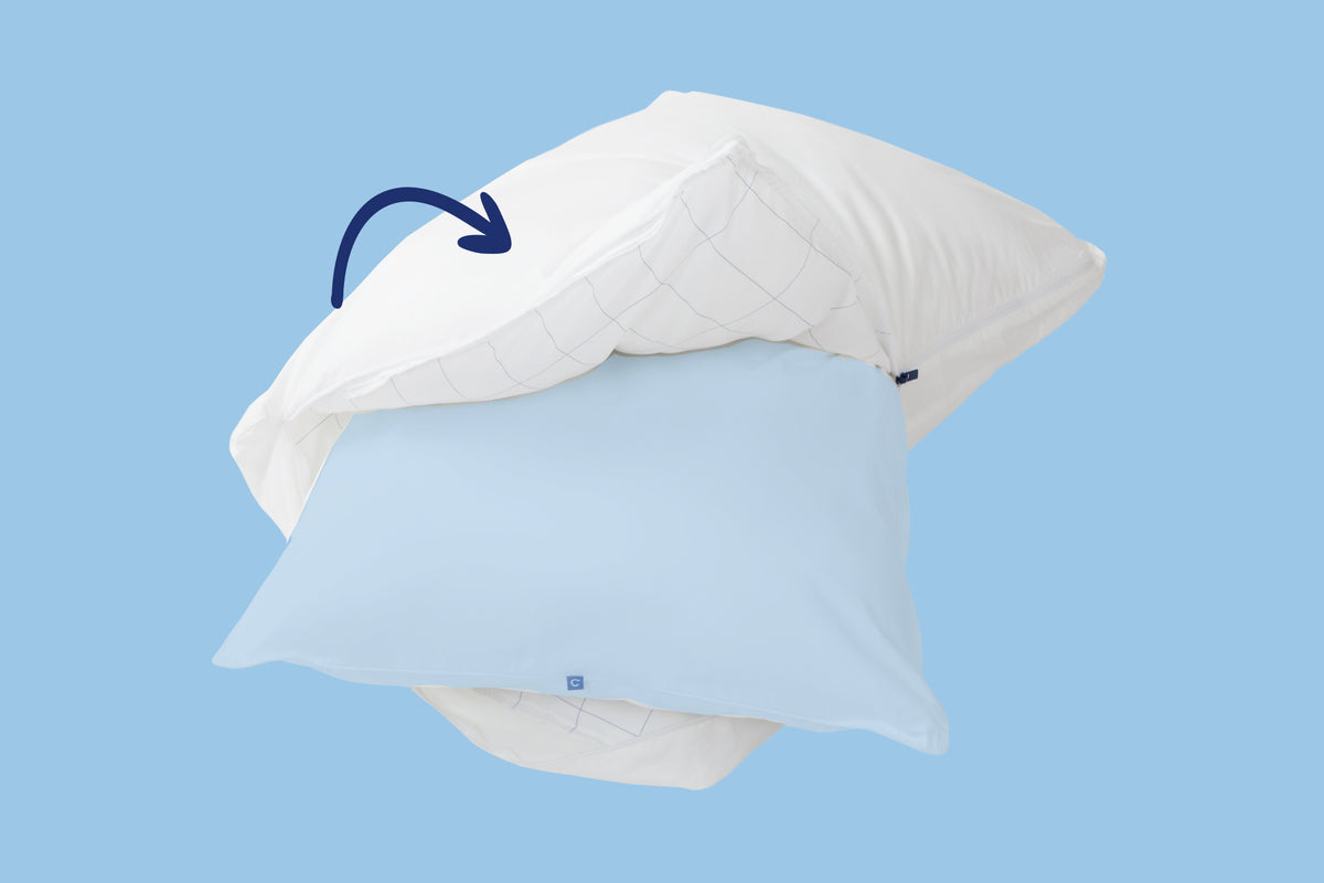 Original Pillow, unzipped, with the inner pillow sticking out from the outer pillow. Light blue background. An arrow points to the outer pillow.