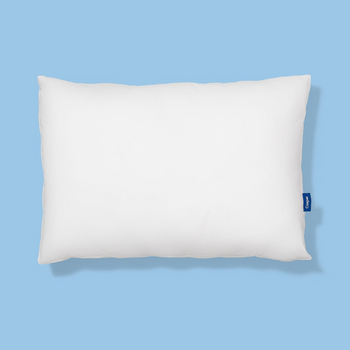 White pillow with a brand logo on a light blue background