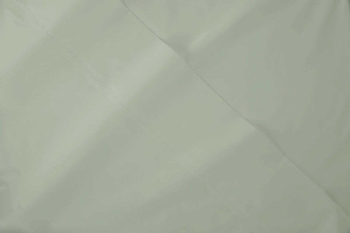 Close-up view of Percale fabric in eucalyptus-green colorway