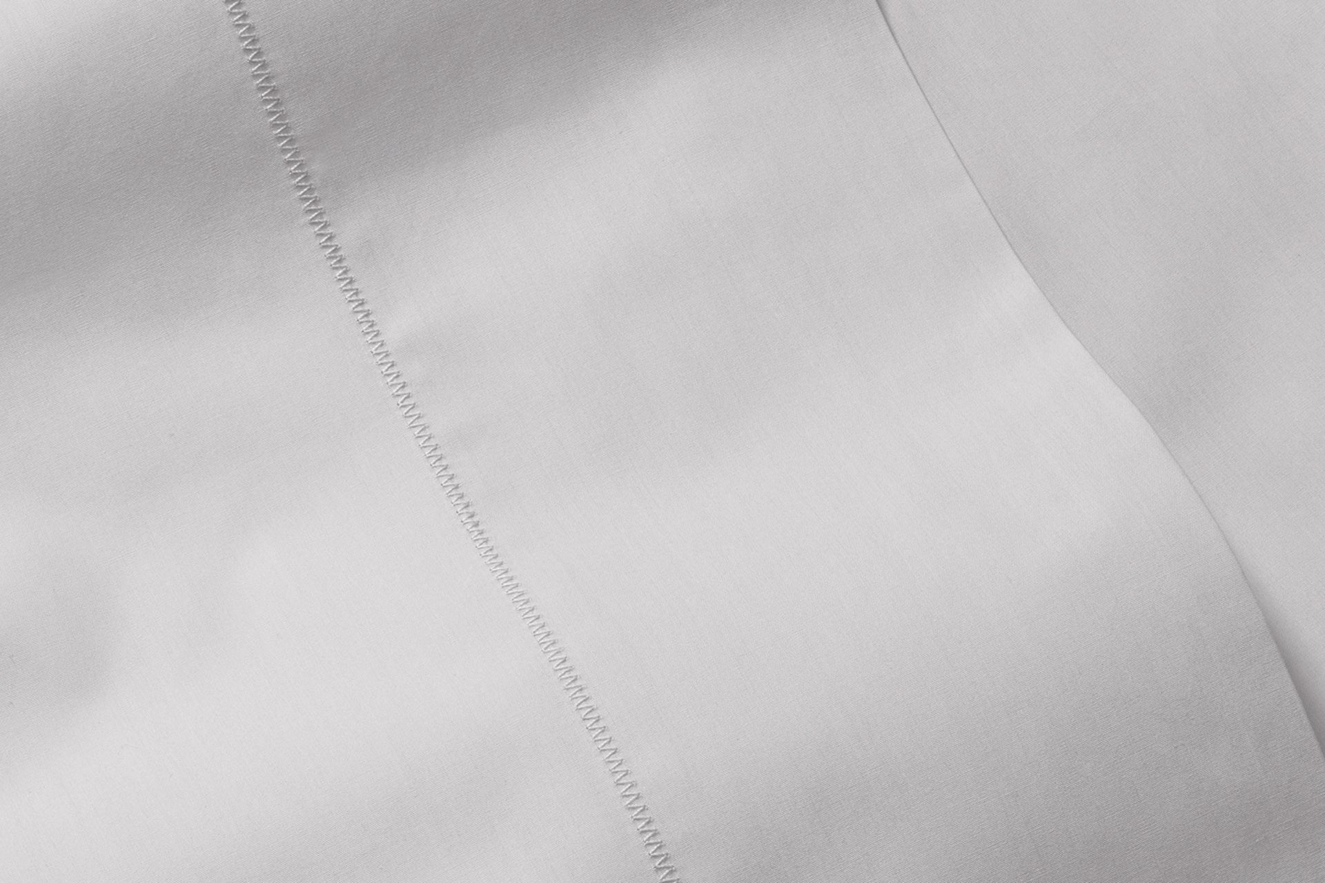 Close-up of percale sheet set, gray
